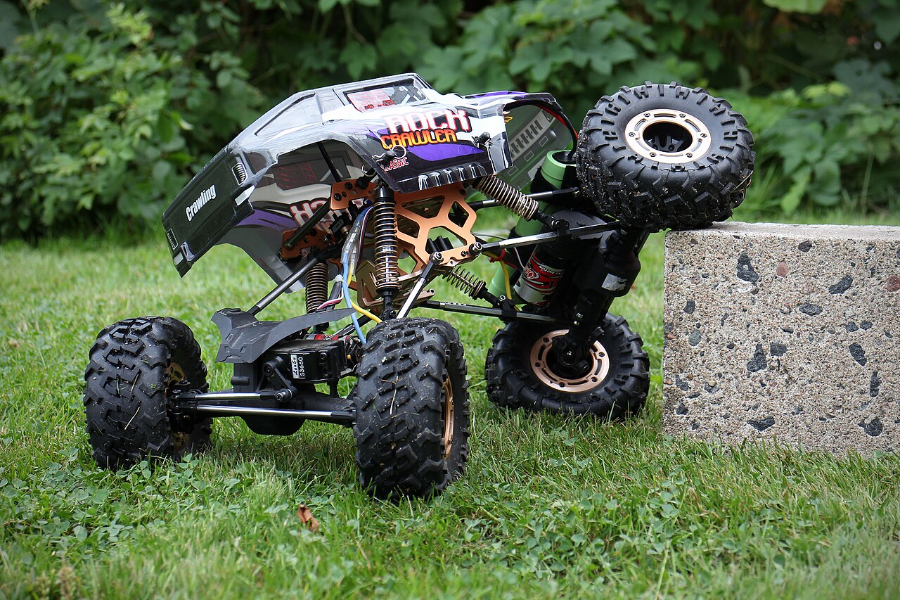 An RC rock crawler on rocks.
