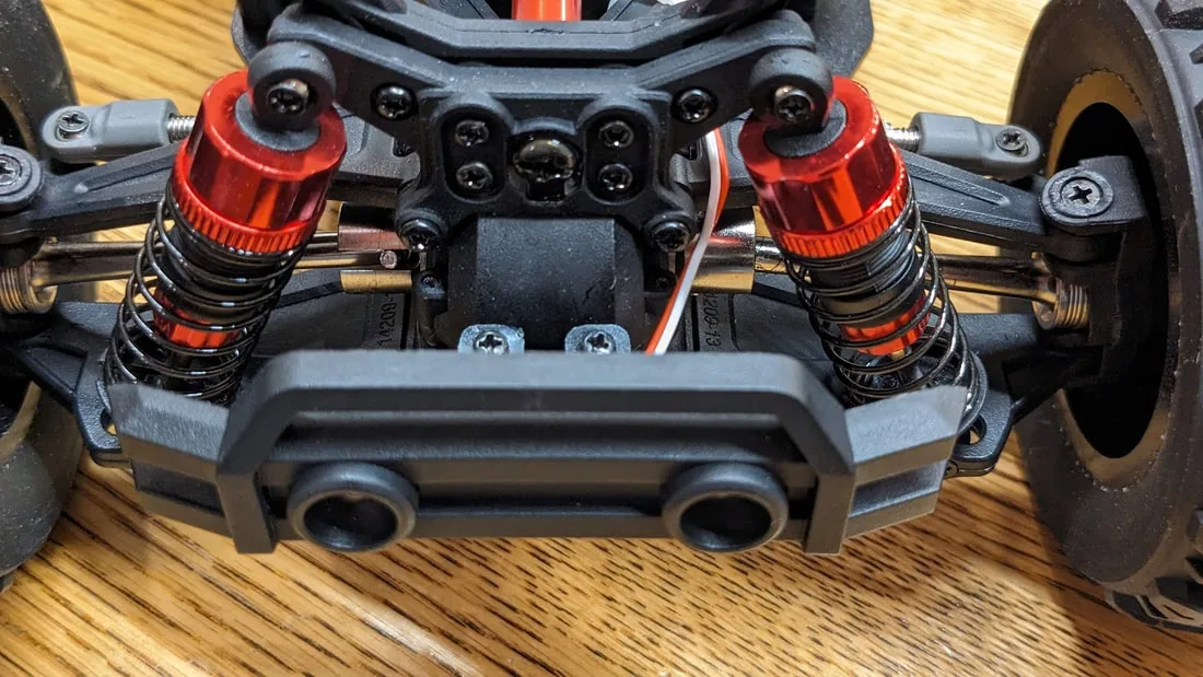 Close view of the front suspension and bumper on an MJX Hyper Go 14210.