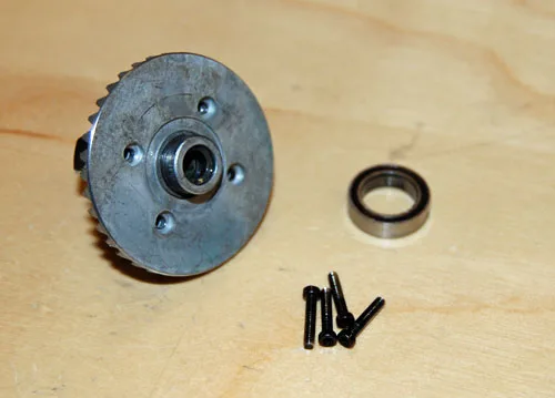 Axial ring gear, bearing and housing screws on a workshop bench