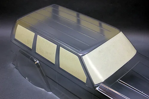 Clear Jeep Cherokee body shell with window masks applied