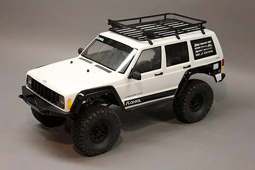Finished Axial Jeep Cherokee body with decals mounted on crawler chassis