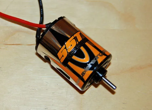 Axial 55-turn brushed motor on a workshop bench
