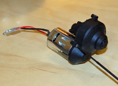 Brushed motor installed against an Axial transmission housing