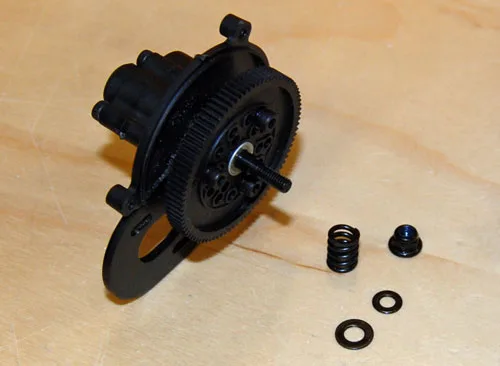 Axial slipper clutch and spur-gear assembly with spring and washers