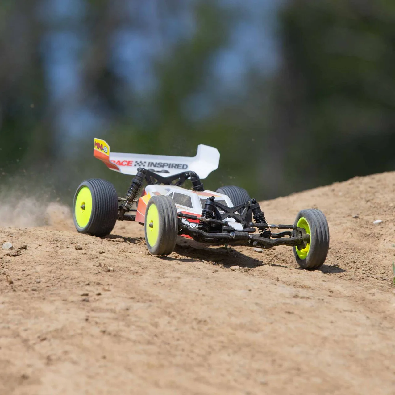 Losi Mini-B 2S brushless buggy driving on dirt.